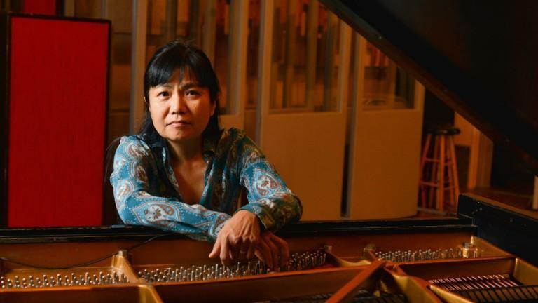 Satoko Fujii with her grand piano.